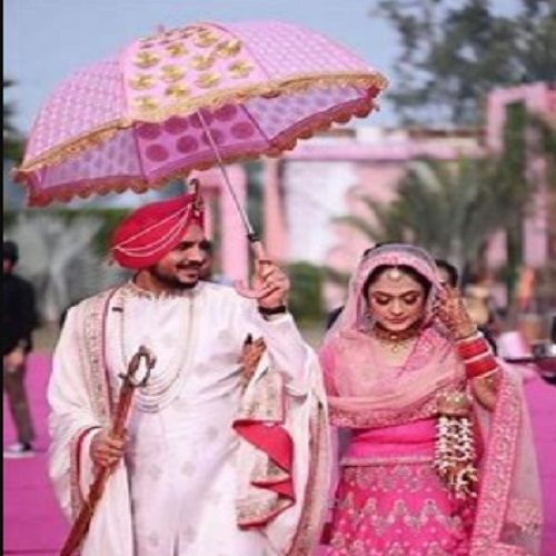 umbrella entry of bride and groom